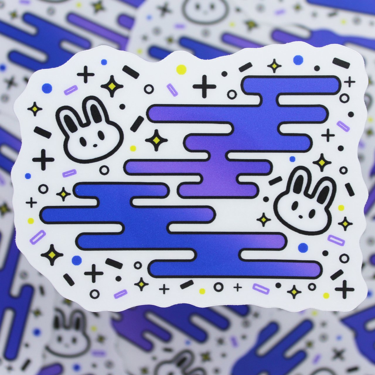 Two kawaii bunnies surrounded by fun shapes, printed on transparent matte vinyl.
