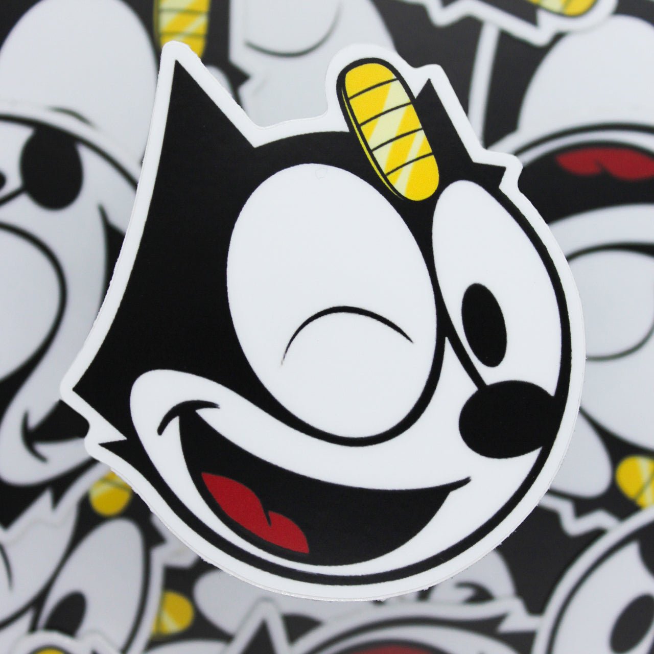 Matte winking Felix The LUCKY Cat sticker with Meowth coin on forehead.