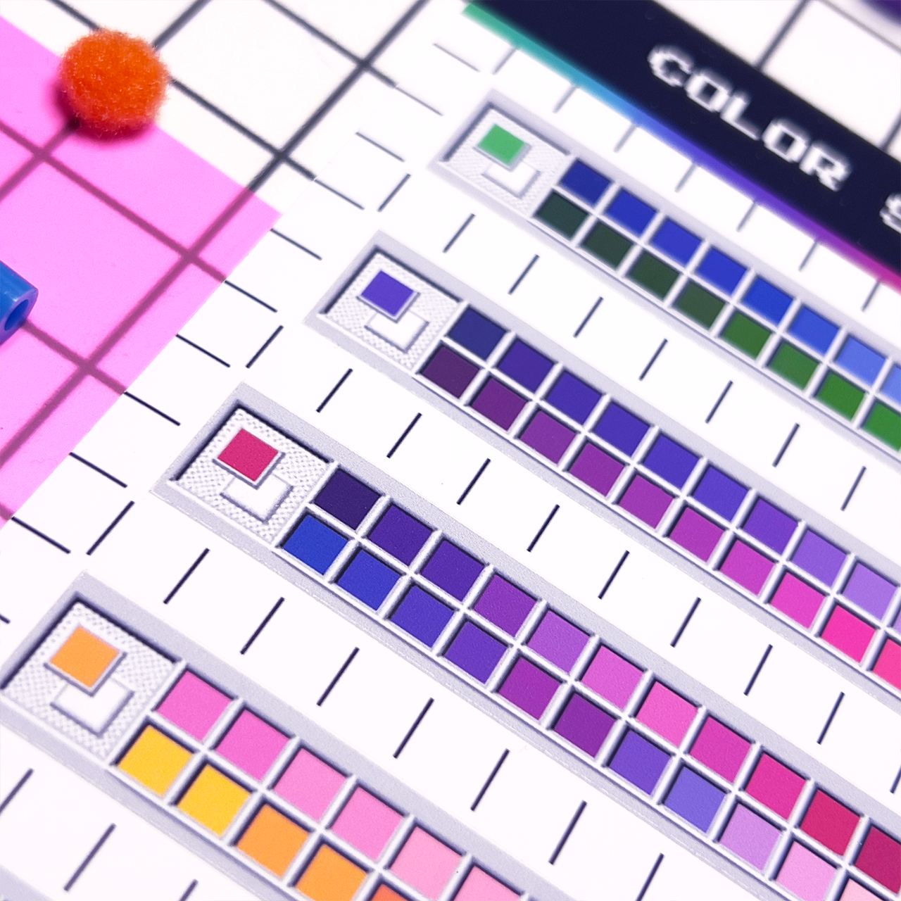 Color swatch chart with various colors on a white  and grid background