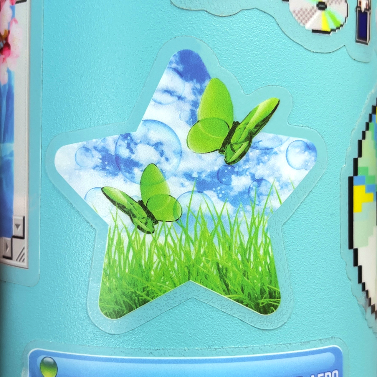 Clear star sticker of Frutiger aero green butterfiles and a cloudy blue sky and bubble background.
