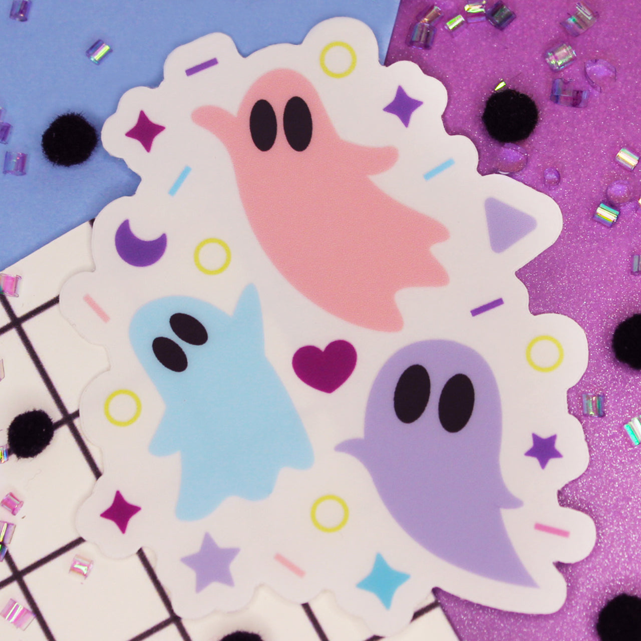 Pastel Halloween sticker with pink, blue, and lilac ghosts with clear background.