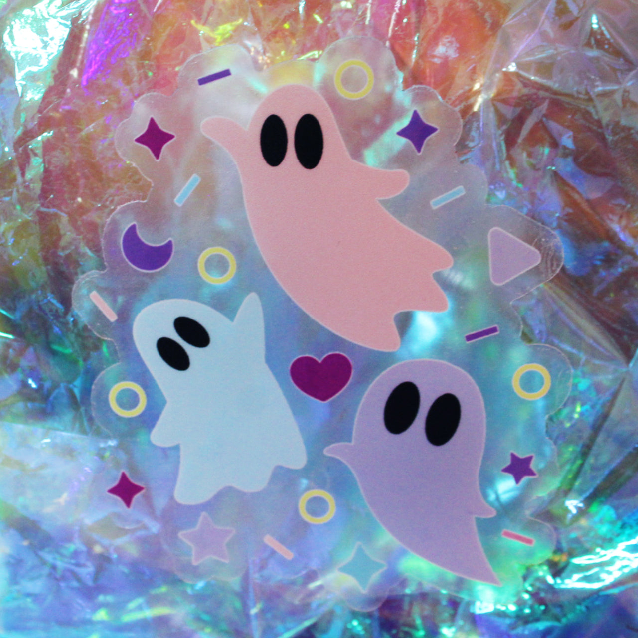 Pastel Halloween sticker with pink, blue, and lilac ghosts with clear background