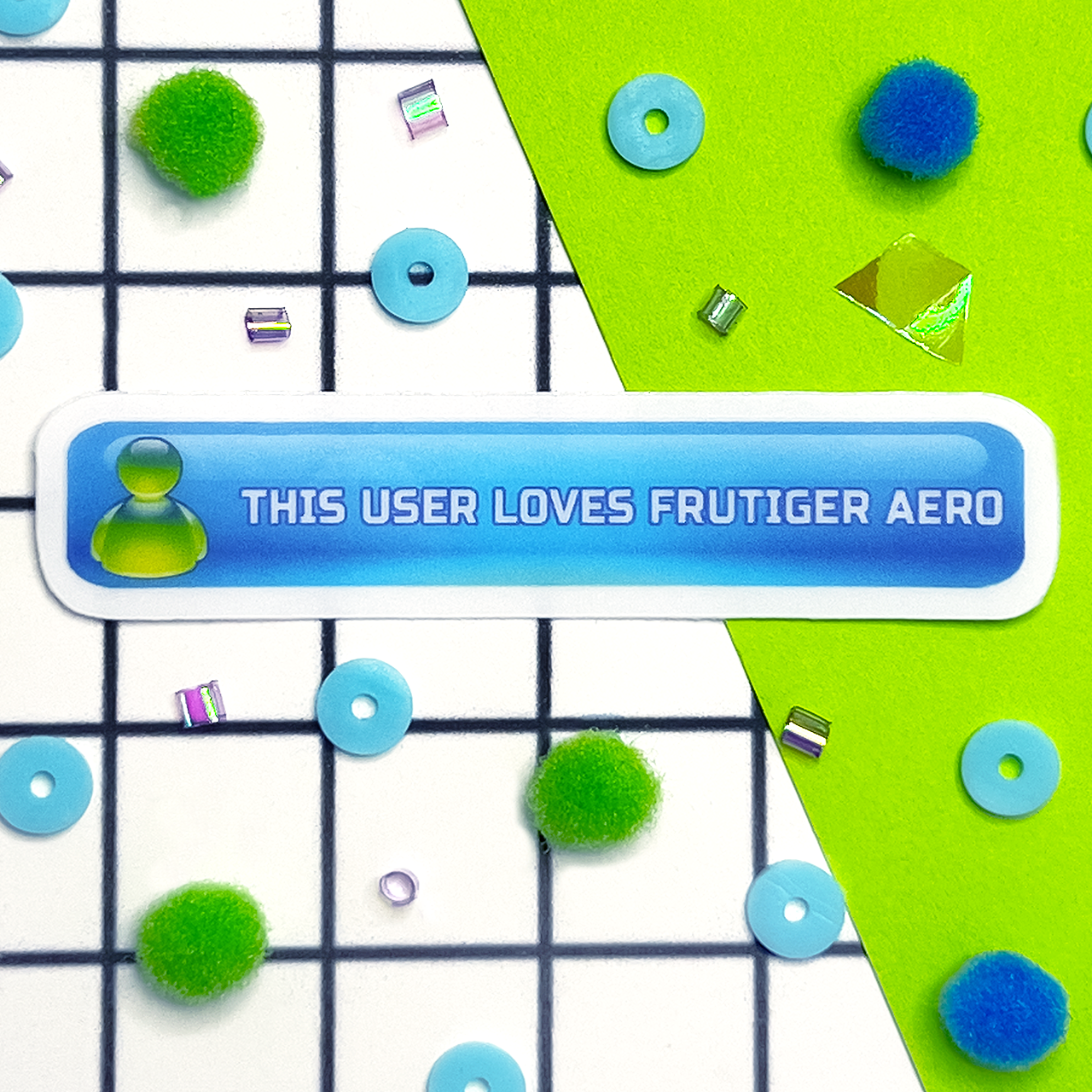 Small sticker with text 'This user loves Frutiger Aero' on a colorful blue button  design