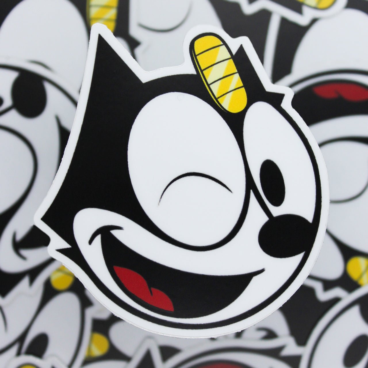 Matte winking Felix The LUCKY Cat sticker with Meowth coin on forehead. 