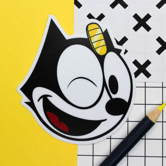 Matte winking Felix The LUCKY Cat sticker with Meowth coin on forehead.