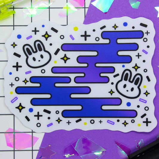 Sticker of two bunnies surrounded by fun shapes. Frosted matte diecut sticker