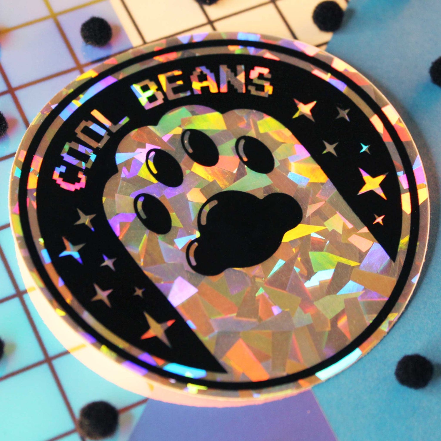 waterproof and holographic cat sticker with a paw that says cool beans