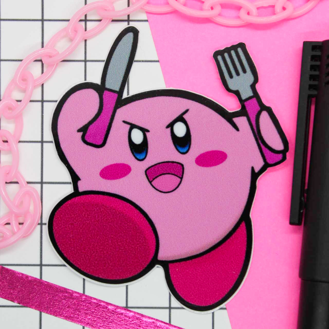 Kirby vinyl sticker, kirby holding a knife and fork. 