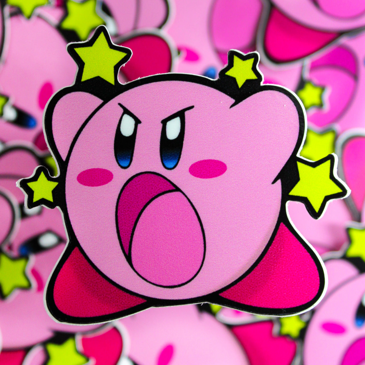 Pink Kirby sticker with yellow stars in background